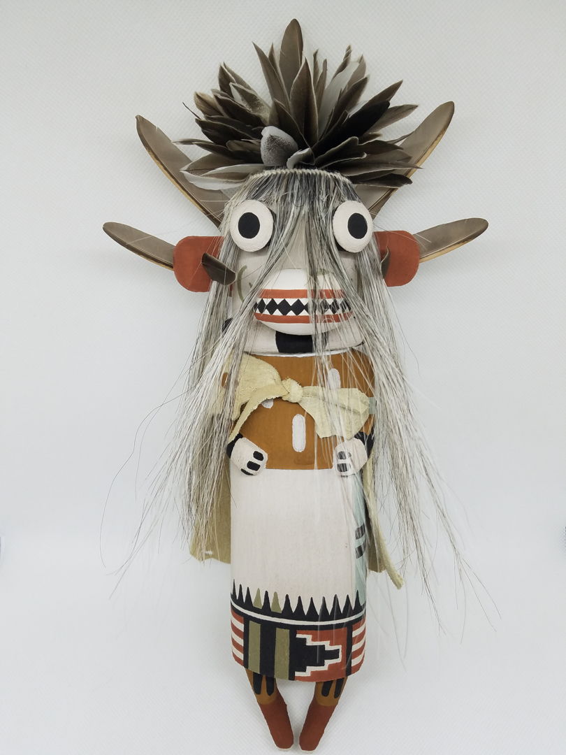 Carved from cottonwood root  painted with natural earth pigment paints. Other materials used  duck  quail feathers and horse hair.