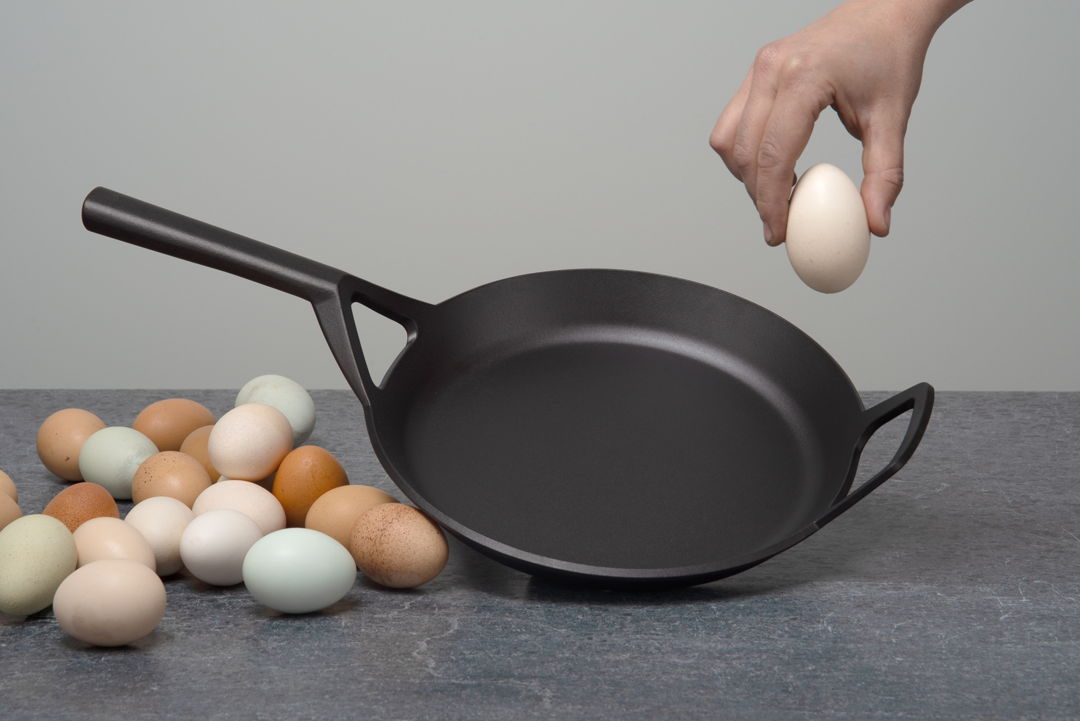Our 10.5" Frying Skillet is hand cast from recycled brake rotors. It features a thick base  gently sloping sides and forked handle that stays cool on the cooktop.