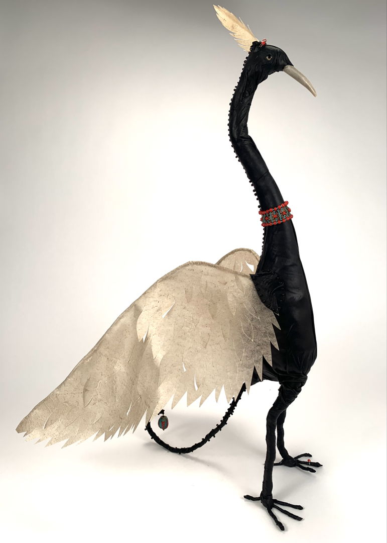 Leather Avian with pierced rawhide wings  antler tip beak  extensive hand beading and stitching. Flexible wings
