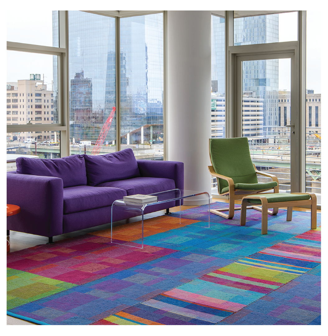 Contemporary rag rug handwoven in 100% cotton yarn and fabric strips using the traditional Log Cabin Weave technique