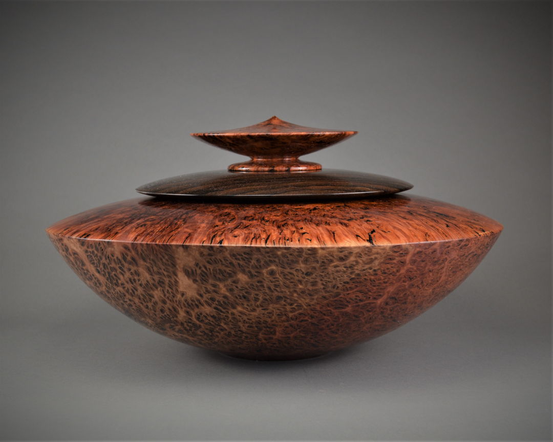 Large contemporary Jarrah hollowed out vessel with Ziricote hollowed out center Disc Set Box and Jarrah lid.