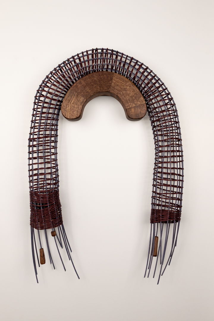 Wall-hanging sculpture. Walnut wood  dyed reed  waxed thread  brass hardware