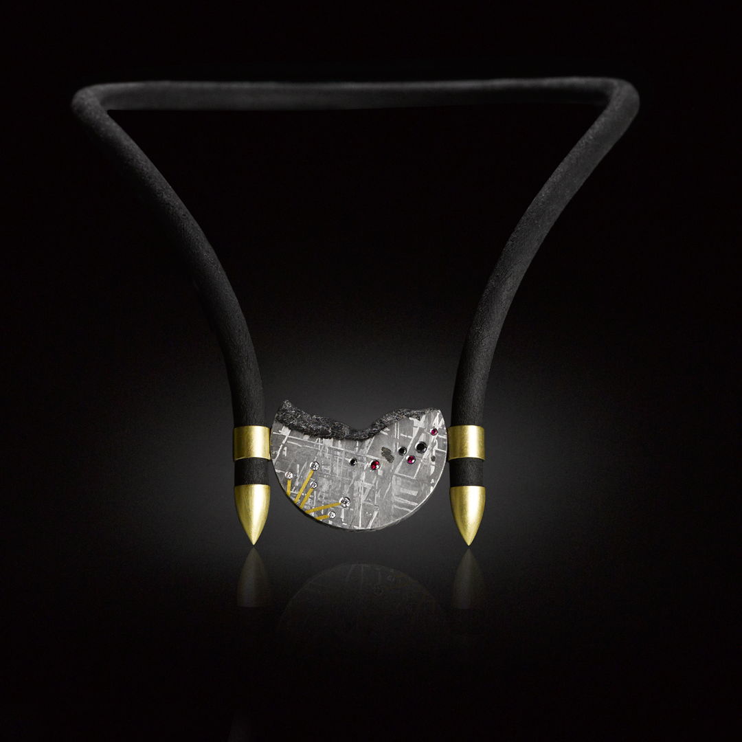 Adjustable  reversible necklace and bracelet in Gibeon Meteorite  18k gold  neoprene  rubies  and black and white diamonds. Cast  fabricated  and etched.