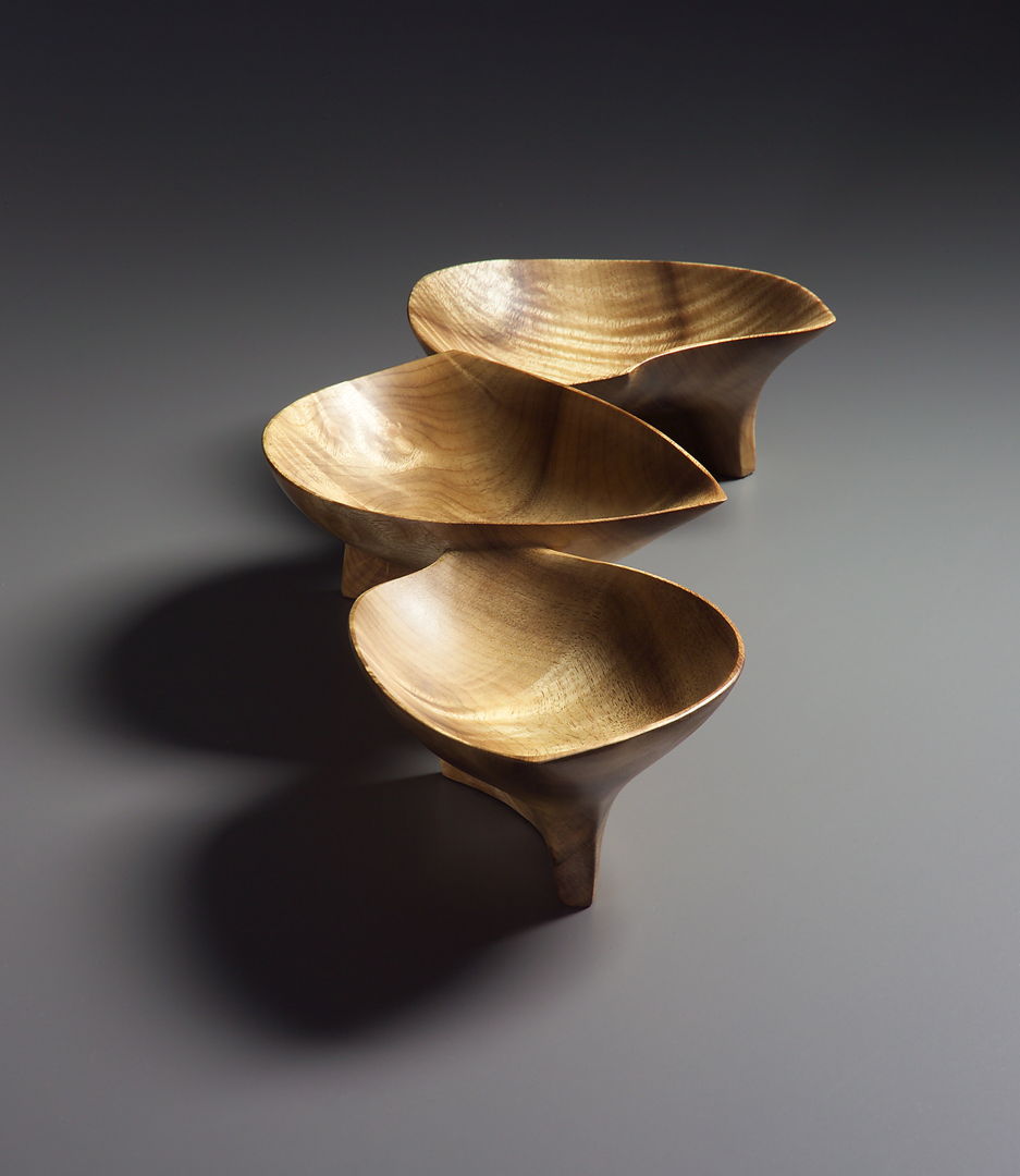 This piece is composed of three connected bowls carved from a single piece of myrtlewood.