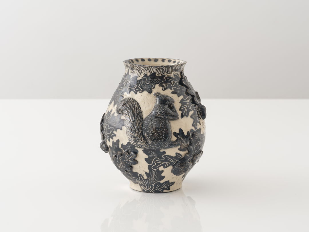 Materials: white stoneware  slip  glazes Techniques: handbuilt with sgraffito decoration