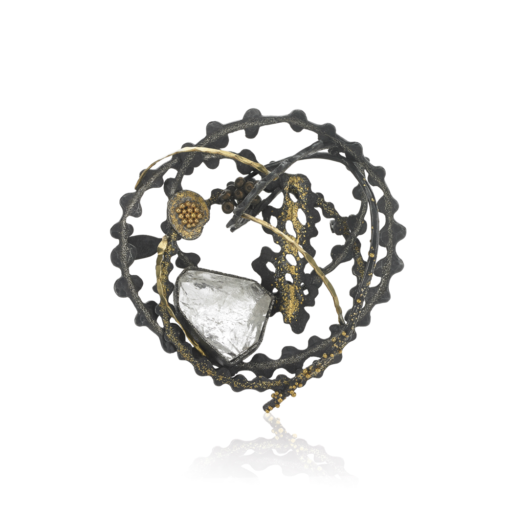 Enhanced with white topaz  this piece showcases 18k and 22k pink gold  24k gold  shakudo  platinum  and sterling silver. Meticulously crafted through forging and fusing techniques  it exudes elegance and innovation.