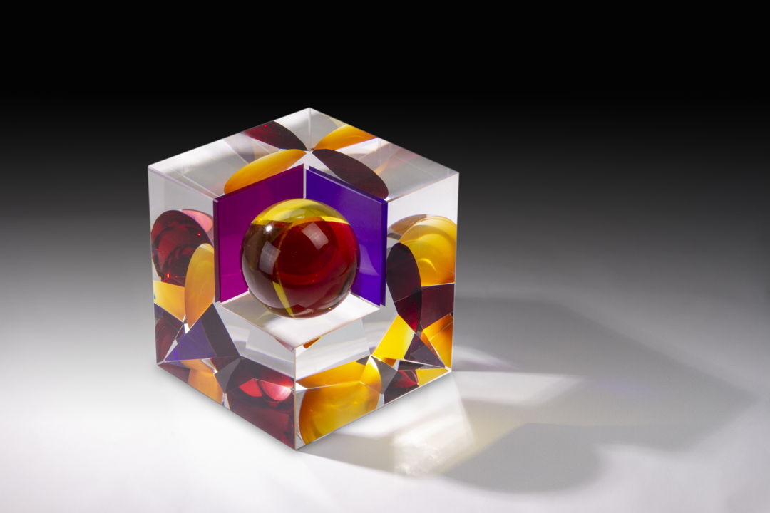 Optical glass that has been cold-worked: a centuries old Bohemian technique using no heat  but rather room temperature glass is shaped using water and abrasives in conjunction with lapidary tools. The techniques involved are cutting  grinding  polishing  laminating and coloring.