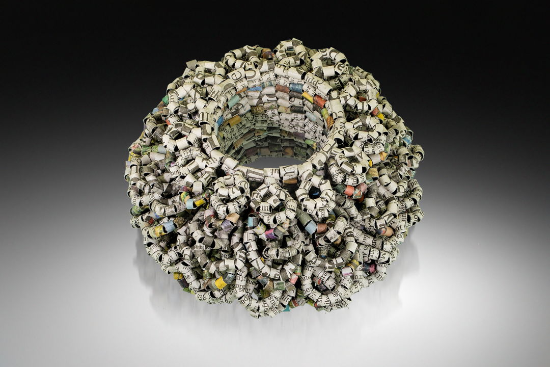 Recycled New York Times newspaper Headlines  News Text  Headline Color Images  and Headline Black &amp; White images are hand-formed into beads and hand-stitched together into the form of a bracelet. 2022