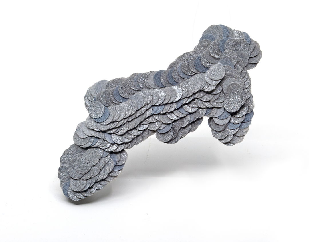 Many small disks are gathered together to form a cloud shaped brooch (or pendant  it's convertible). The material is hand painted  non woven polyester that is stabilized with a long sterling silver spine. The piece has a hand made sterling pin back and a bale for hanging.