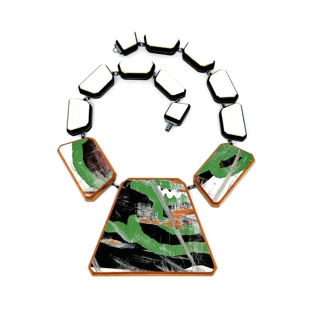 hand carved mexican ebony and maple laminate  handcarved upcycled skateboards  hand fabricated oxidized sterling silver