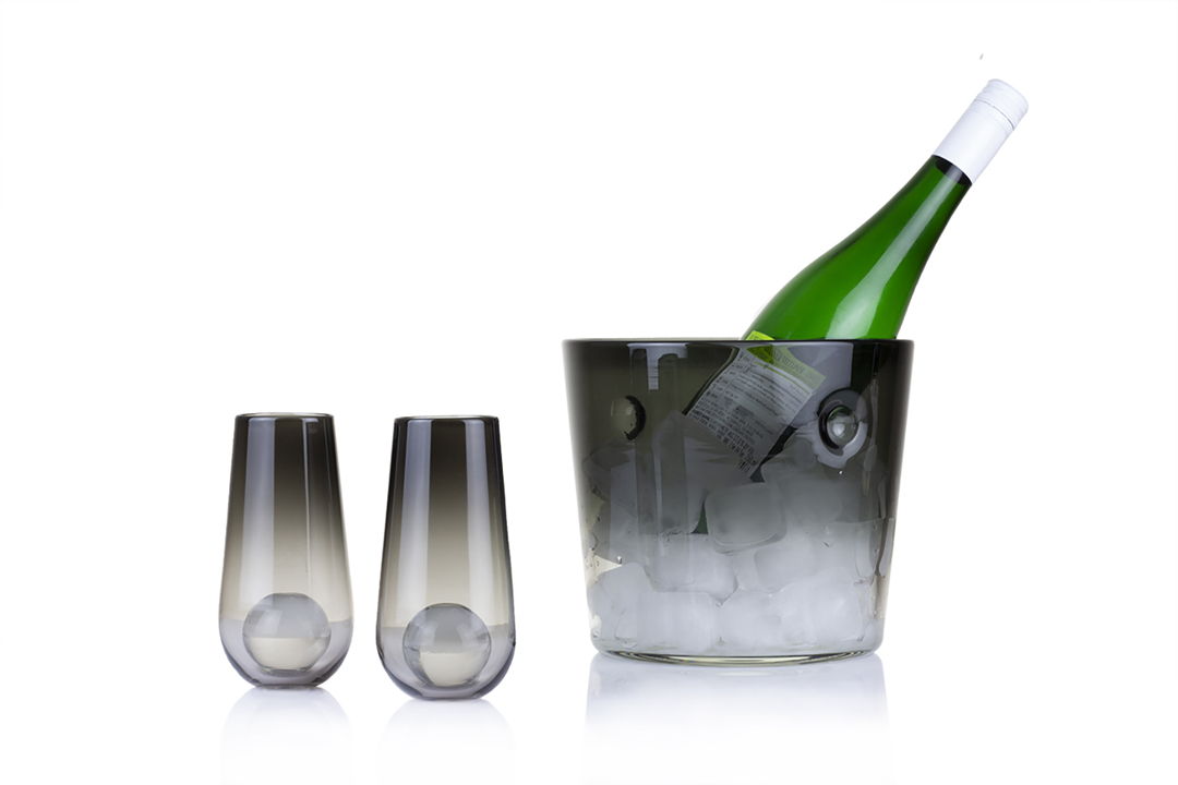The Sphere Glass is designed to chill your beverage without the melted ice. New to the series is our Champagne Flutes and Ice Bucket. Each glass comes with a solid-glass sphere fused inside. Pair seamlessly with our Ice Bucket
