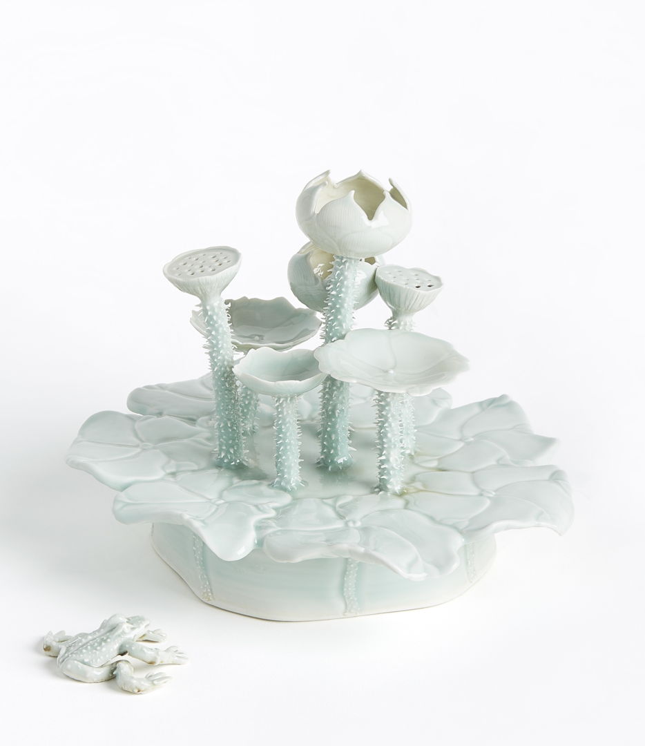 porcelain lily pad with lotus flowers and a frog.