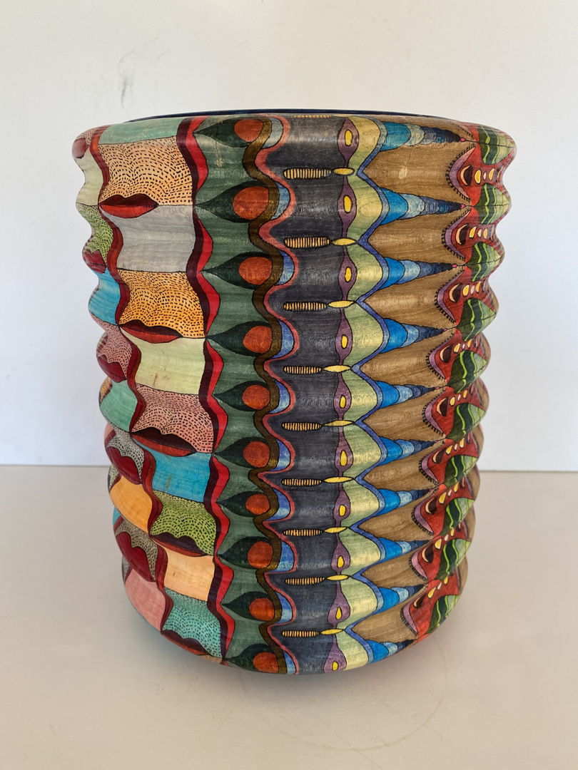 This wood turned vessel of unknown origin became an interesting and challenging surface design. Due to the undulations of the entire surface  surface designs became more flowing along the vertical axis.