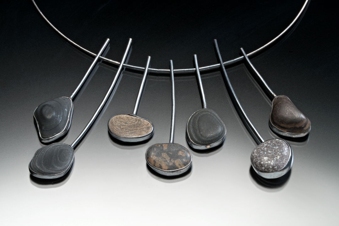 hand fabricsted necklace of sterling silver and rocks