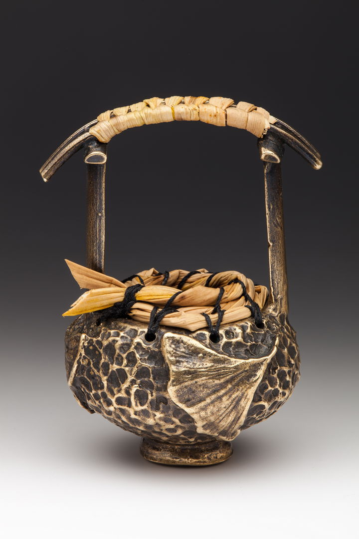 Cast bronze basket from coiled and woven sweet grass