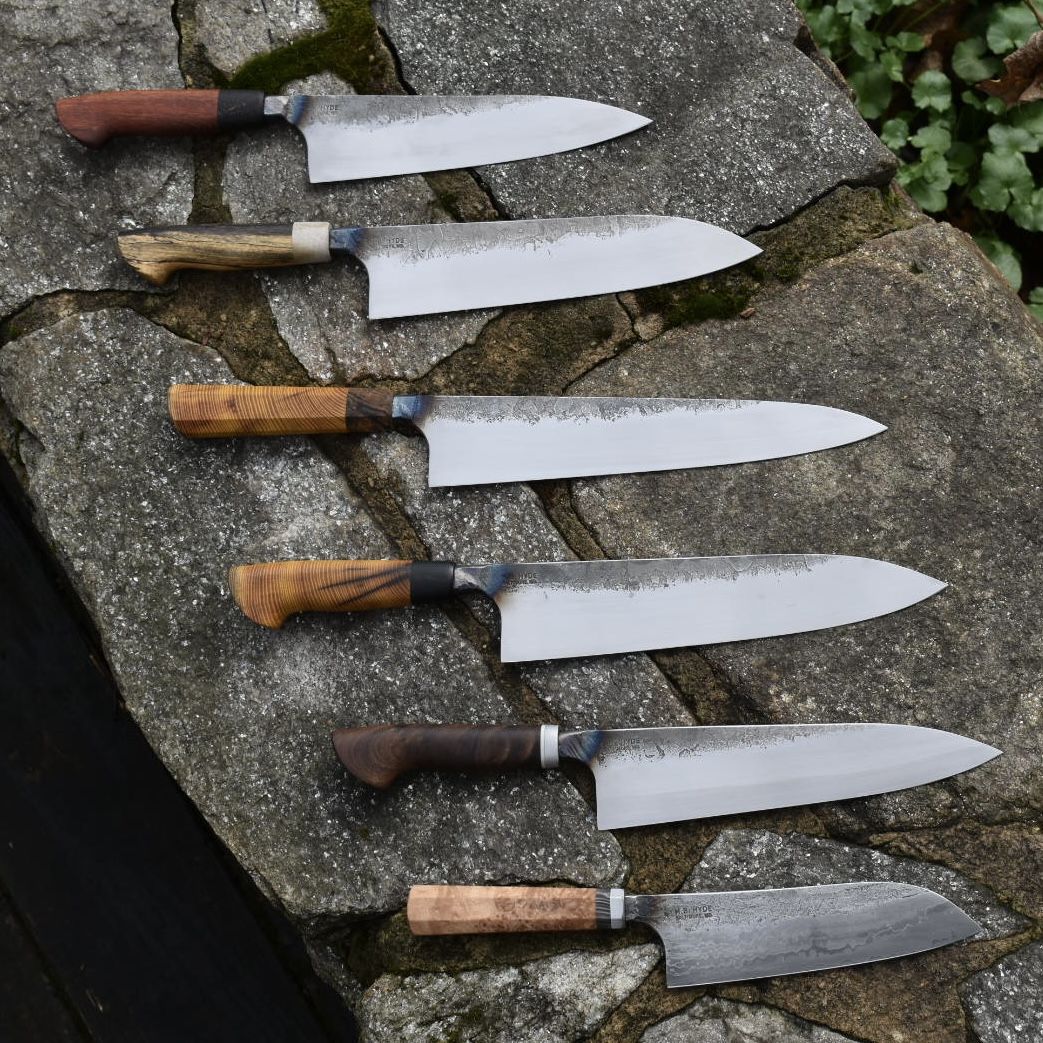 Six chef knives from a production run. A good representation of the many styles of knives I make. There are a mix of local and exotic materials in the handles. These knives run between $450-550.