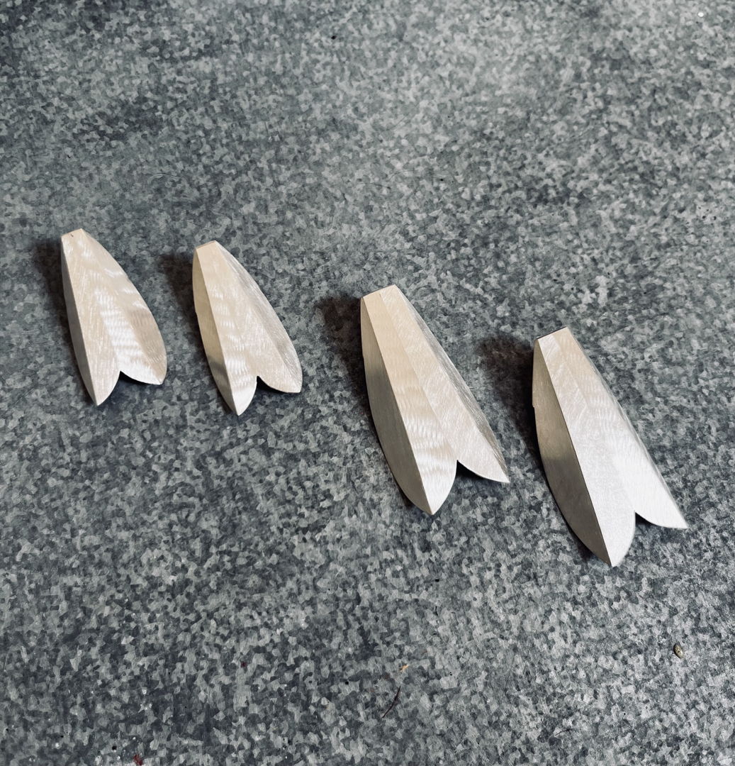 Hand formed from sterling silver sheet. The earrings are open in the back. Ltd. Edition