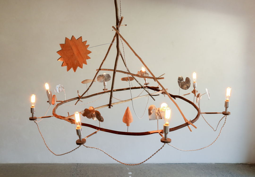 Rousseau Chandelier fixtures reclaimed wood  found branches  carved details  white twist cord  hammered silver reflectors and candelabras