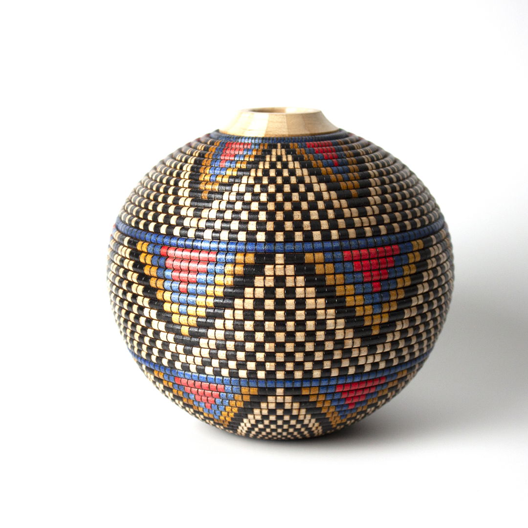 Turned and hollowed Maple vessel embellished with pyrography and hand-dyed with archival ink to give the appearance of a woven basket.