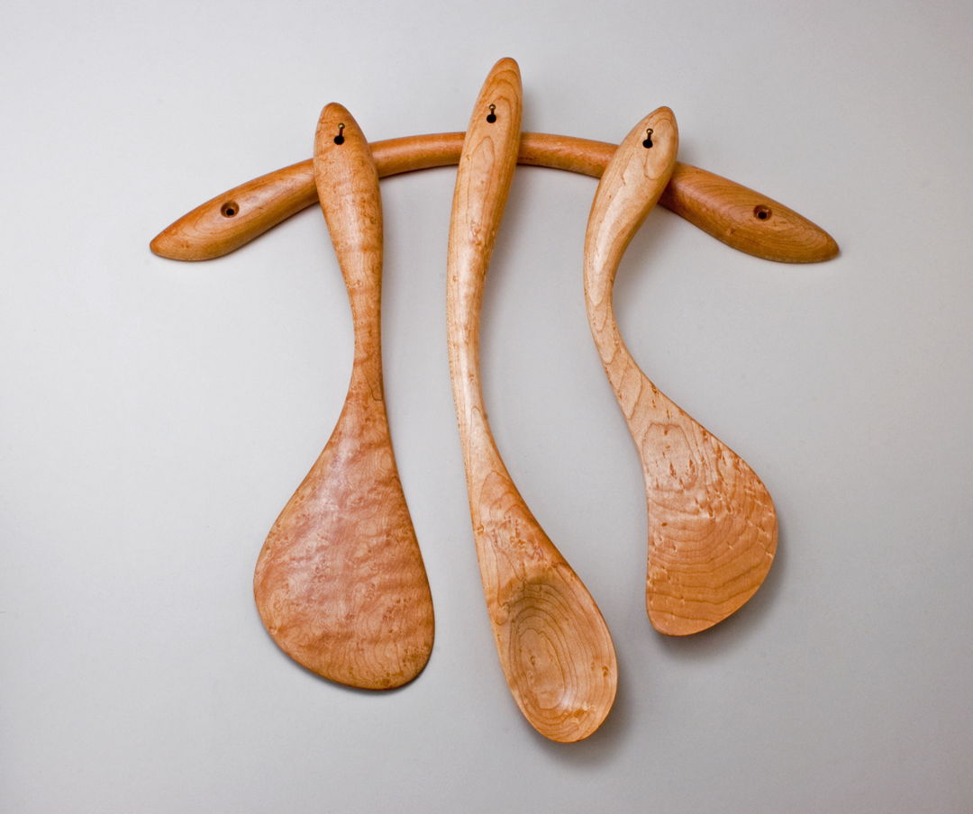 Hand-carved  hand-sanded Set of Three Cooking Utensils in Birdseye Maple. Intended as a wall-hanging sculpture as well as functional  durable utensils.
