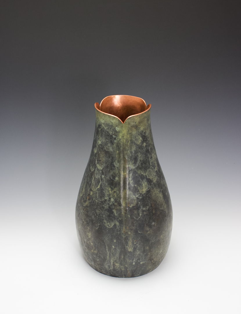 Hand raised copper vase with patina