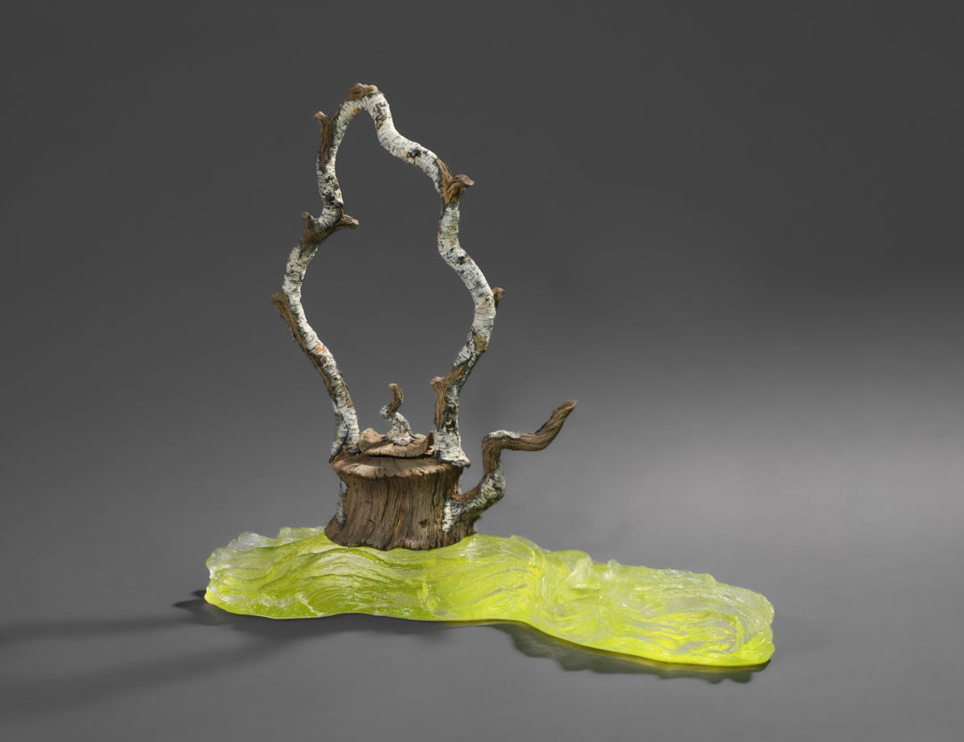 Hand-carved ceramic trompe l'oeil teapot on cast glass stand.