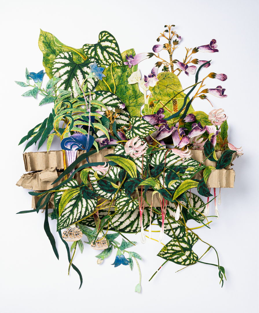 This is a hand cut 3d paper sculpture featuring Japanese floral elements. Each piece is inserted into recycled honeycomb cardboard and glued into place  matted and presented in a shadow box frame