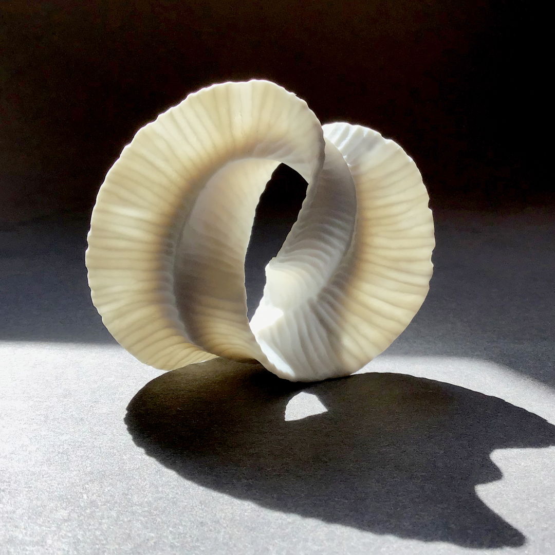 Porcelain sculpture. It has a unglazed surface.
