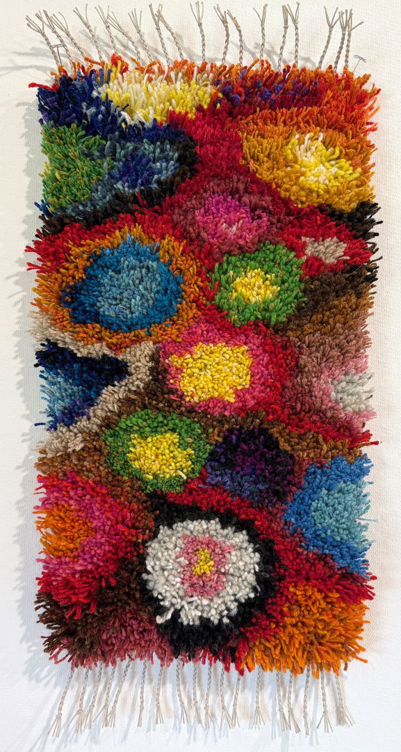 Handwoven backing of linen and wool. Hand knotted wool. Cut pile. To hang on the wall or use as a rug.