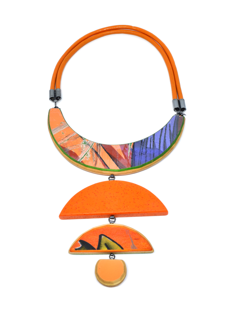 handcut Durat (post-cusumer countertop) and upcycled skateboards with hand-fabricated sterling silver components and leather cord