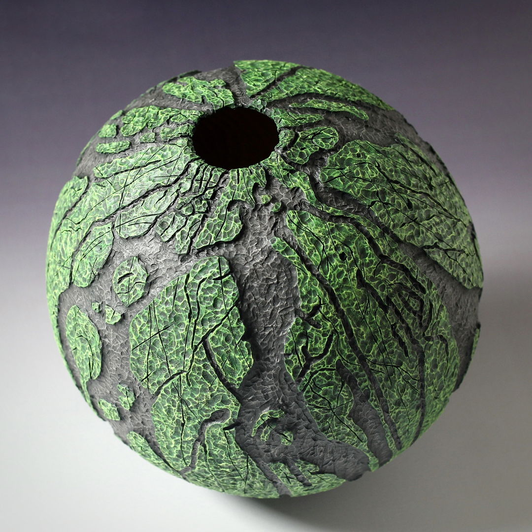 Ash wood hollow form with relief carving  pyrography  and dry brushed acrylics all from one piece of wood.