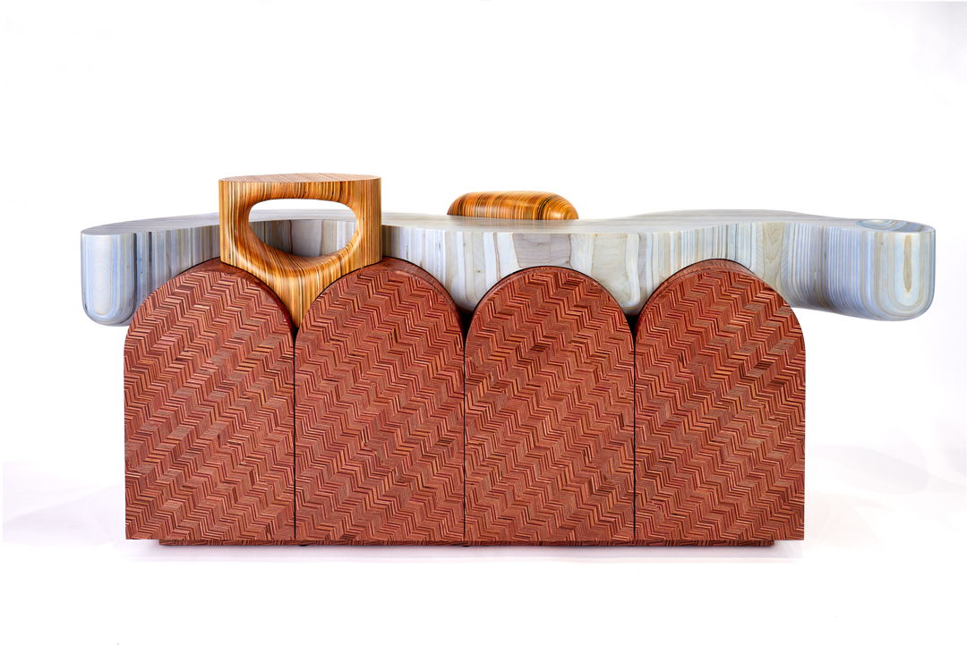 The River is part of Our Nerikomi wood series and is the third rendition of the Nerikomi Sideboard with Plinths. The terra cotta dyed Nerikomi Sideboard is made from our Nerikomi wood material that we create from reclaimed scrap plywood saved from various cabinet shops.