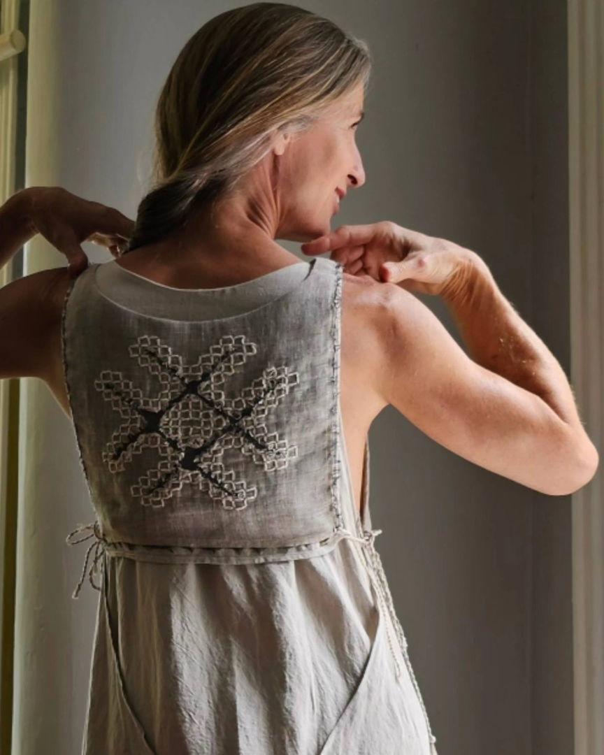 Tabard hand embroidered front and back with traditional ornament from Lyvani area in Latvia.