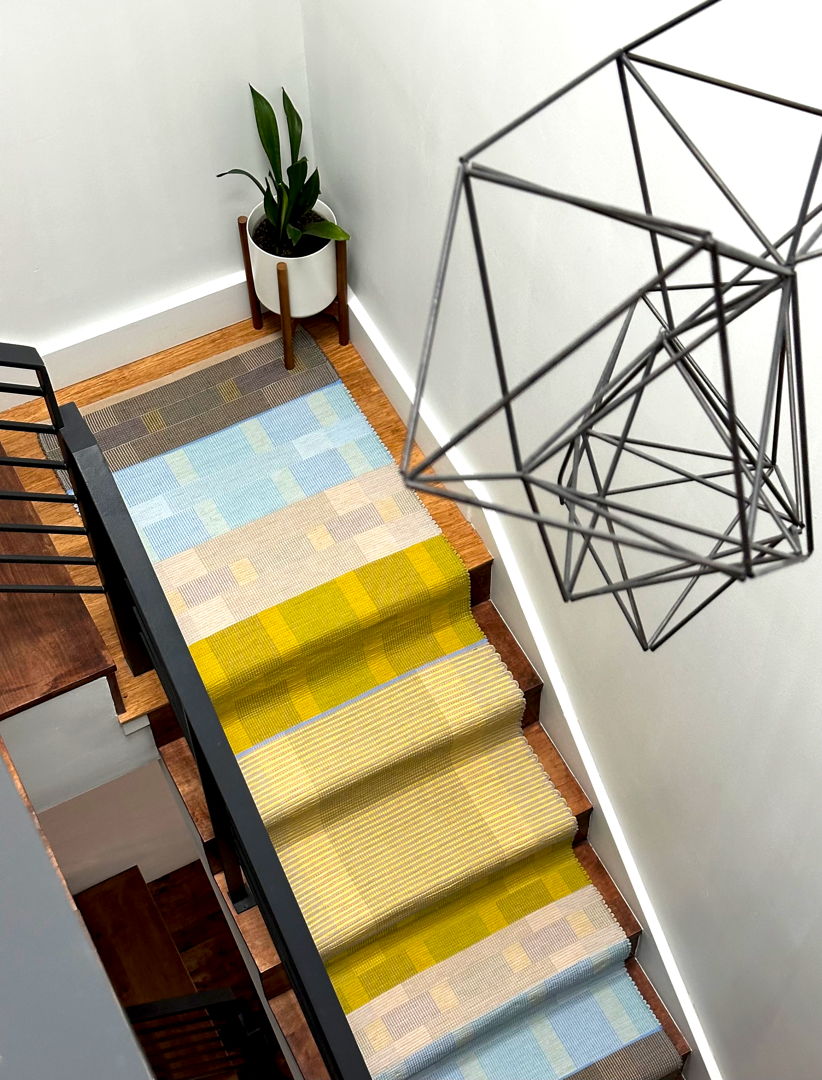 Contemporary rag rug handwoven in 100% cotton yarn and fabric strips using the traditional Log Cabin Weave technique