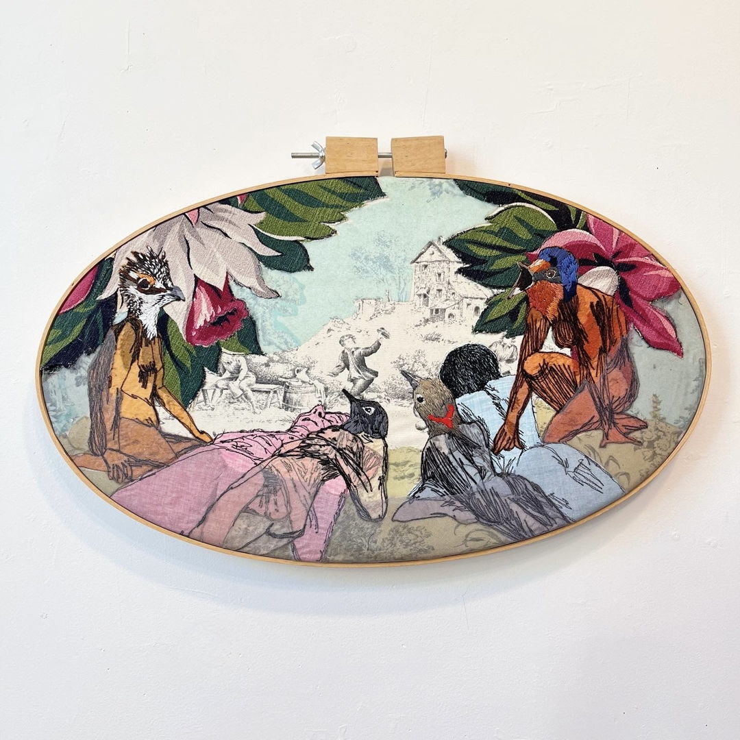 embroidered bird people and birds on  vintage toile decor fabric.