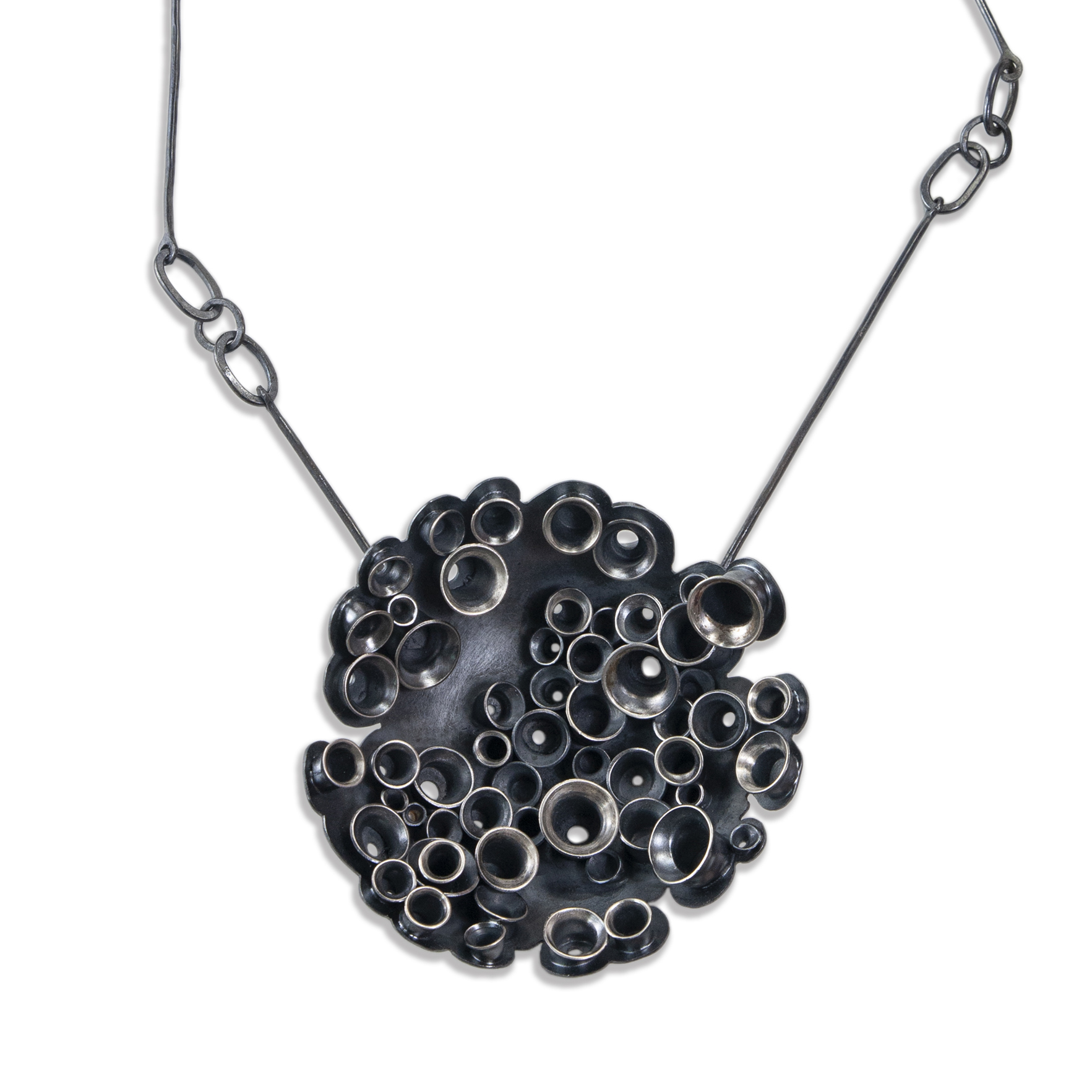 metal necklace with round pitted pendant