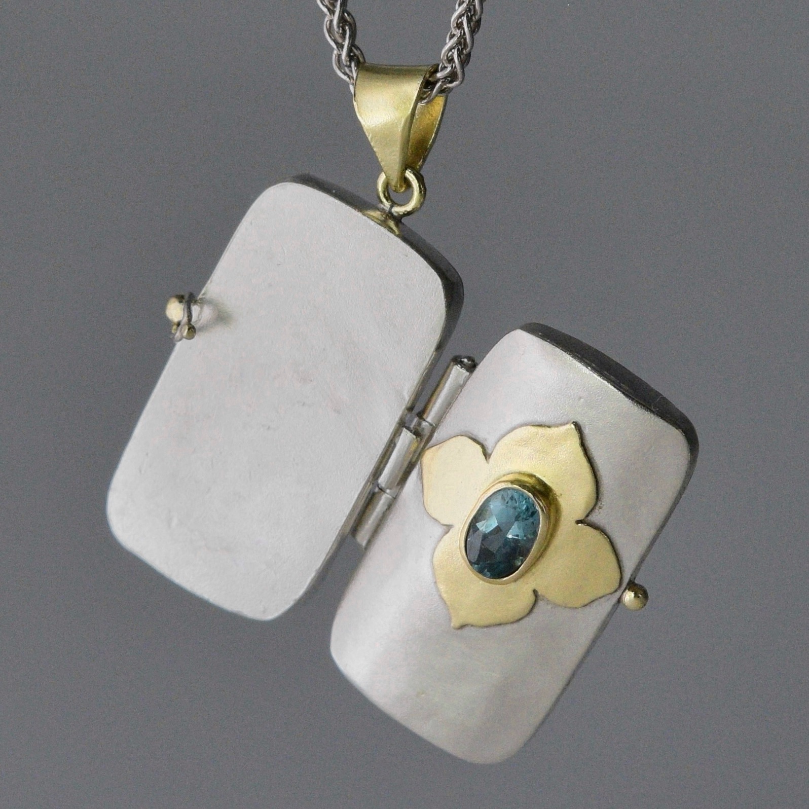open gold and silver charm
