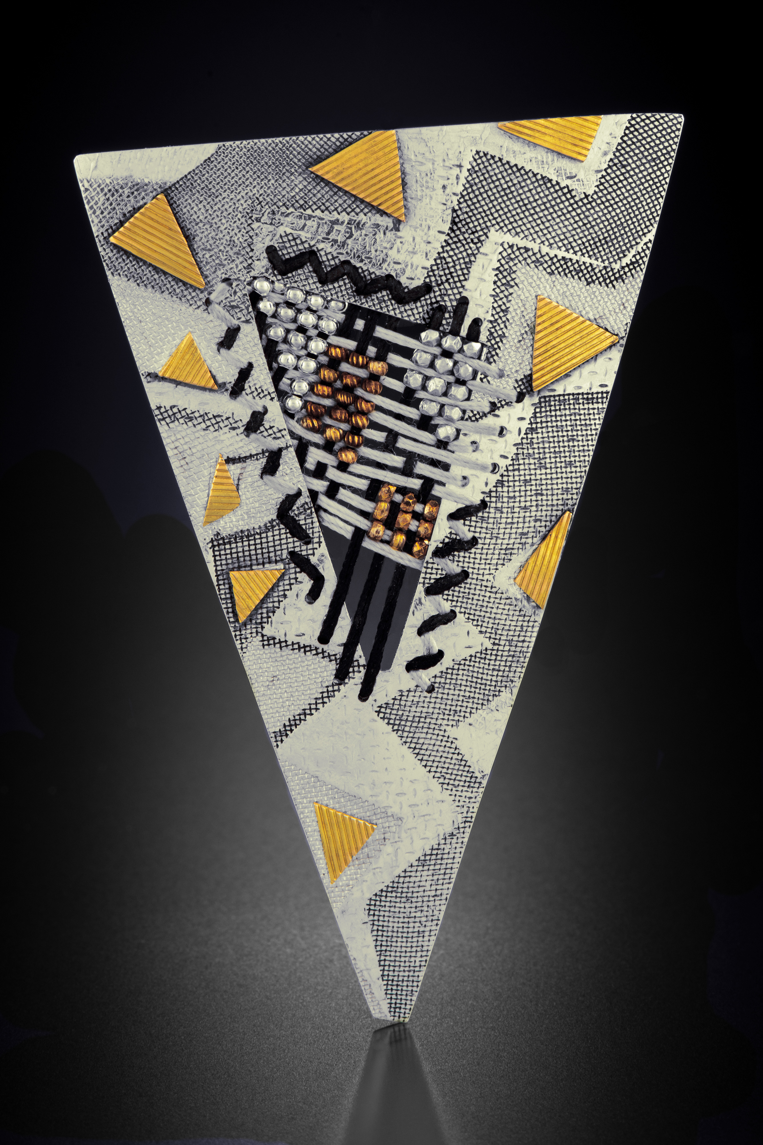 yellow, black, and white pin