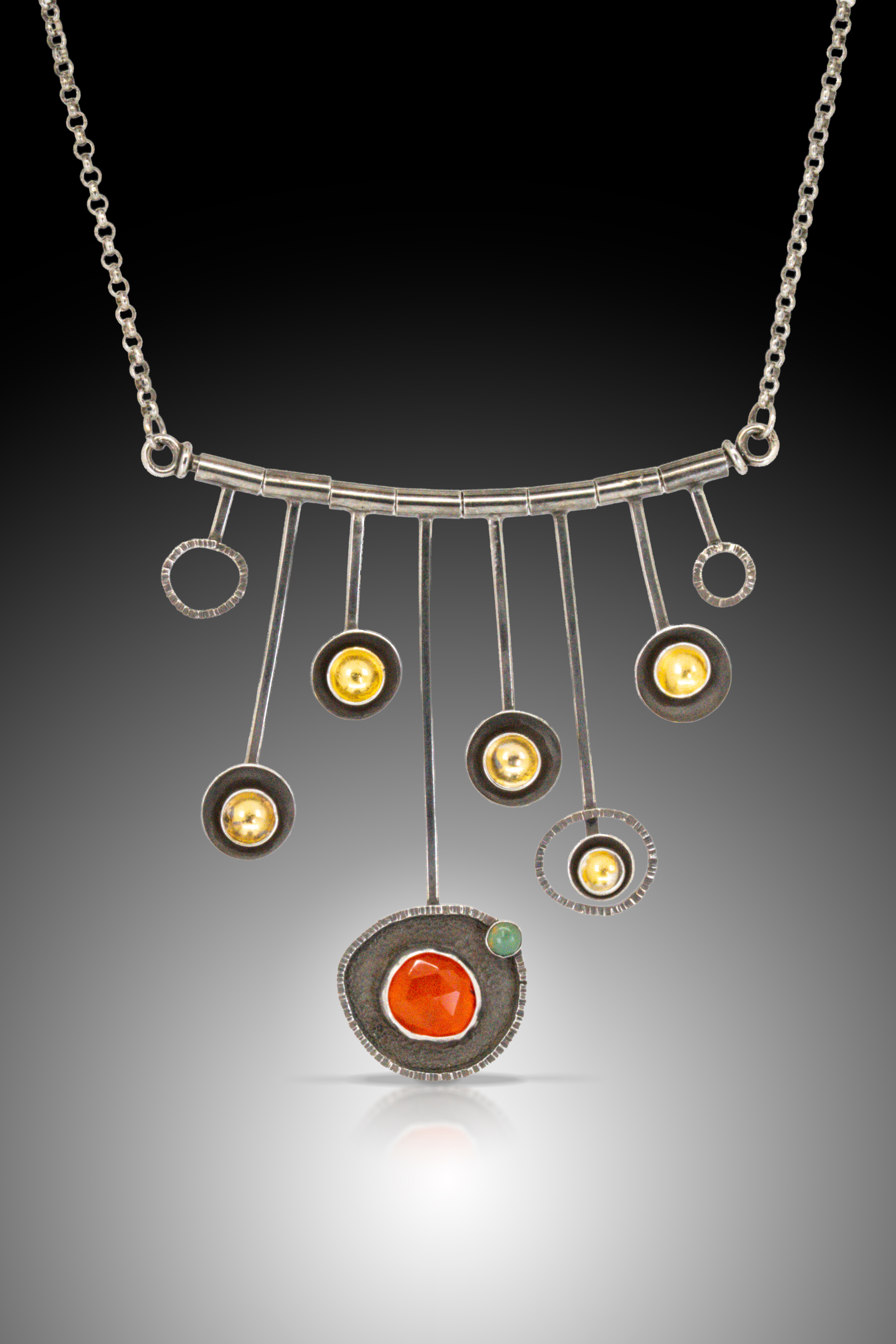 silver and red necklace