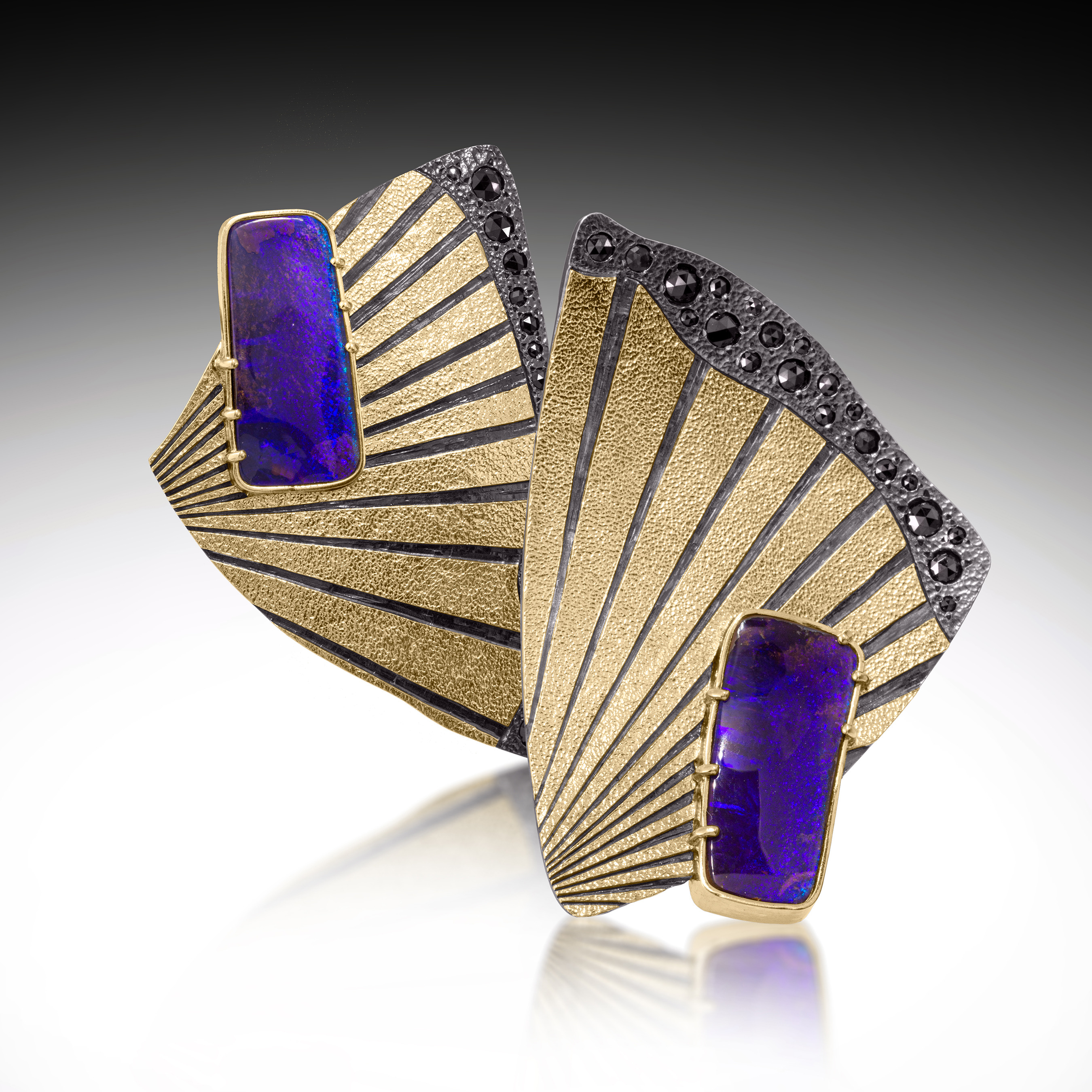 gold, purple, and black earrings