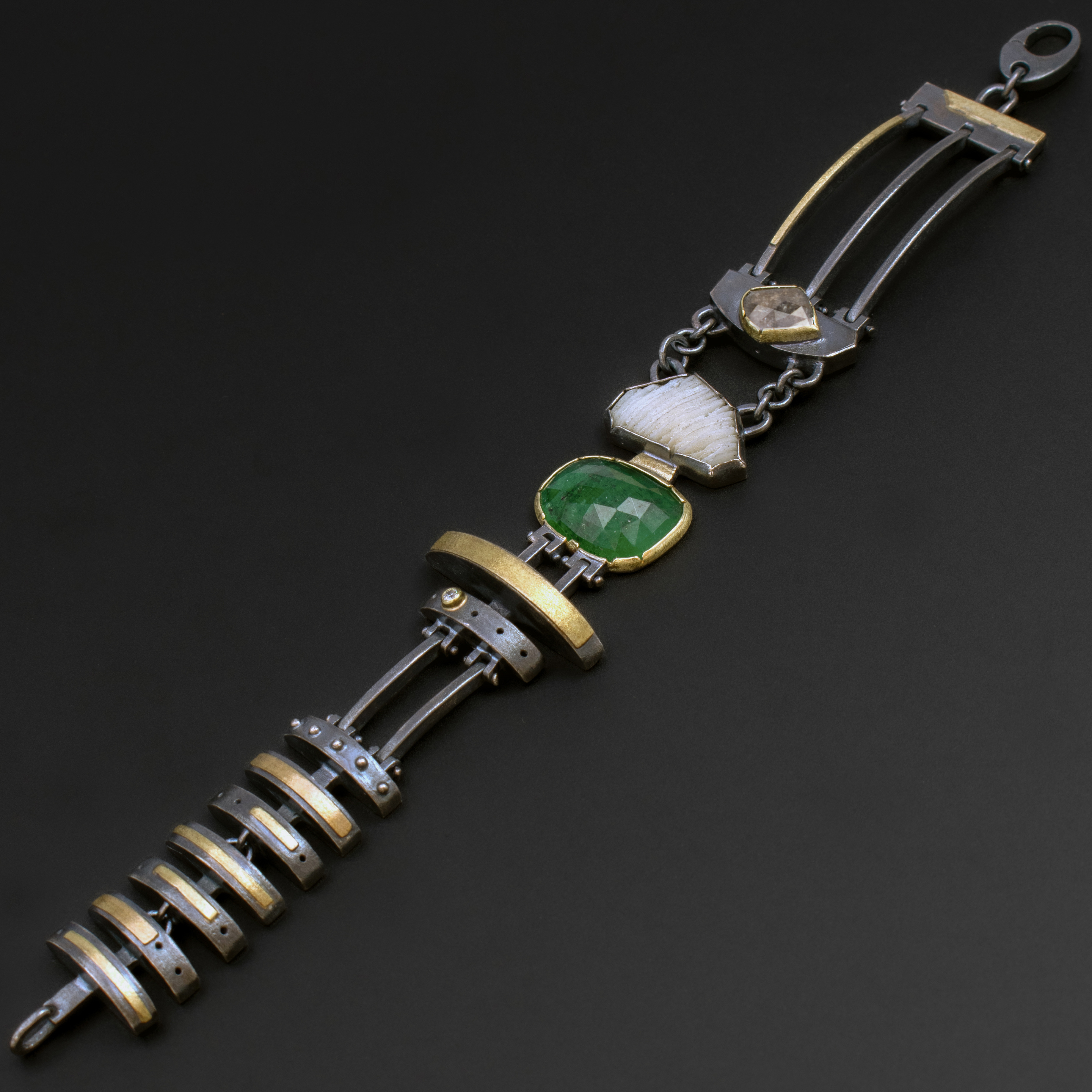 silver, gold, green, and white bracelet