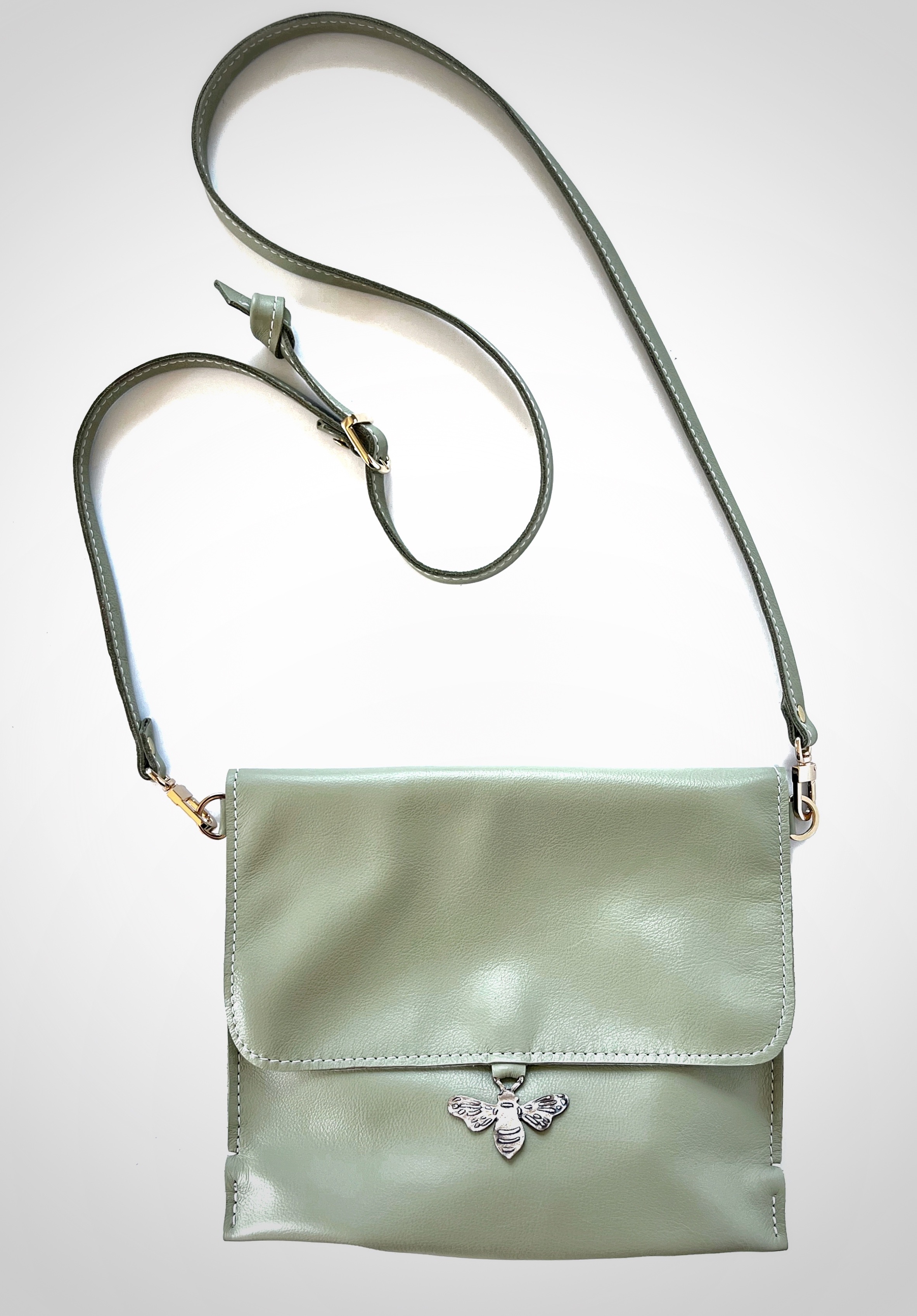 green leather purse with silver bee button