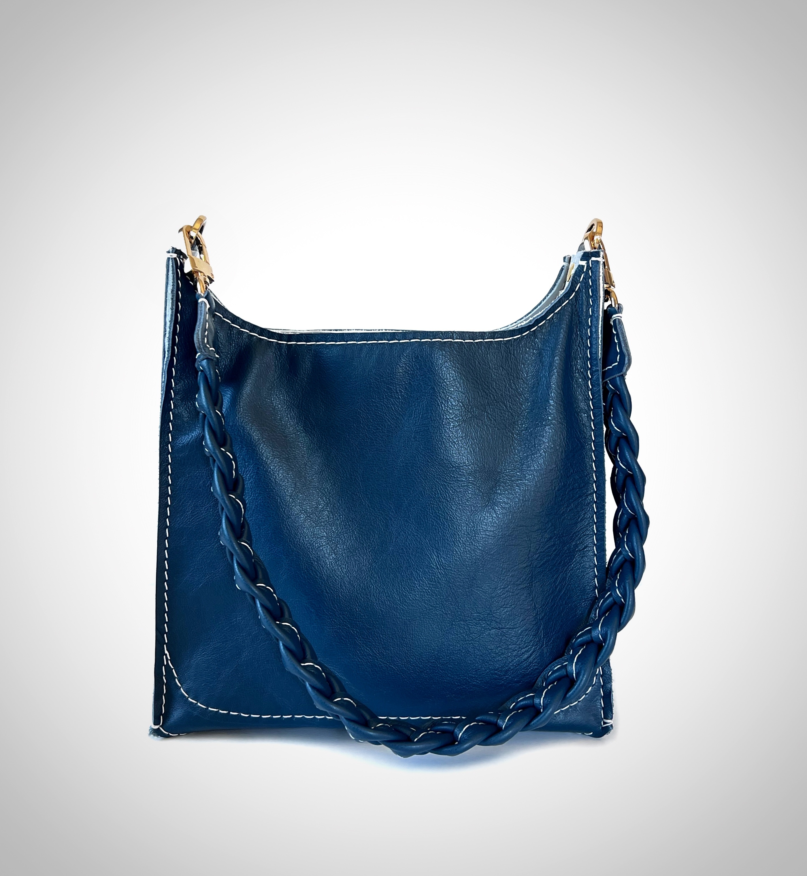 blue leather bag with braided strap