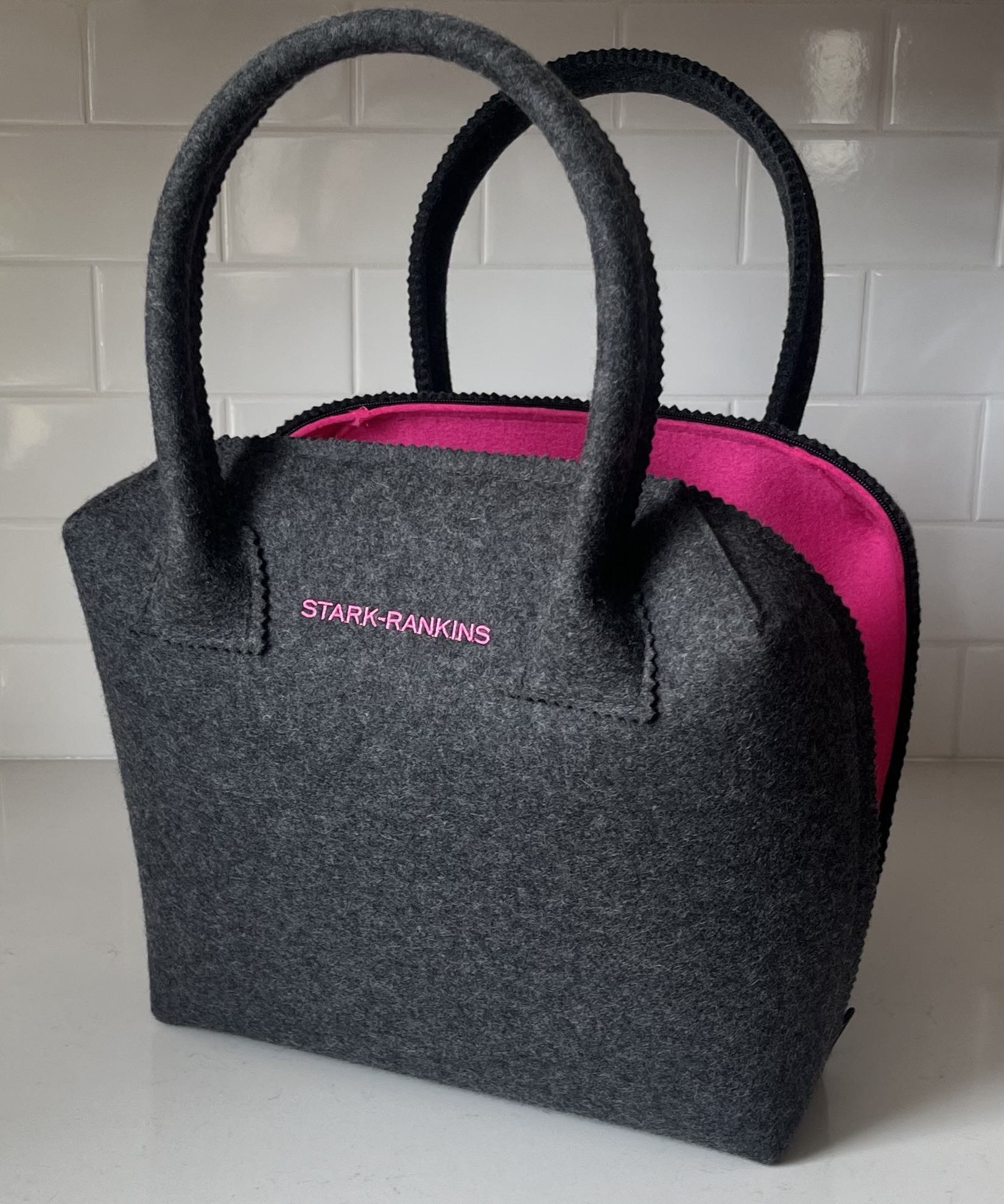 grey and pink bag