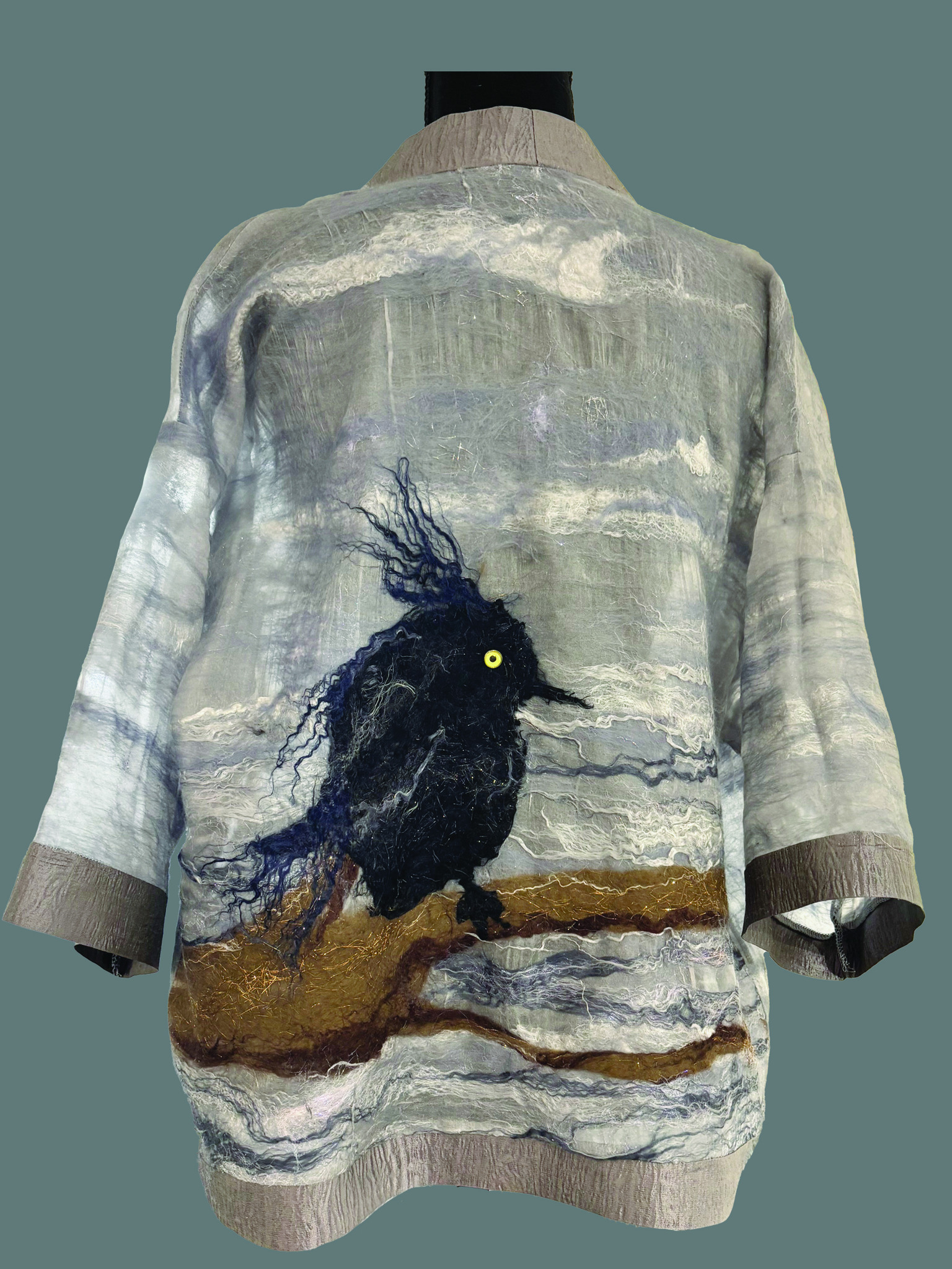 back of a felted jacked with a large black bird