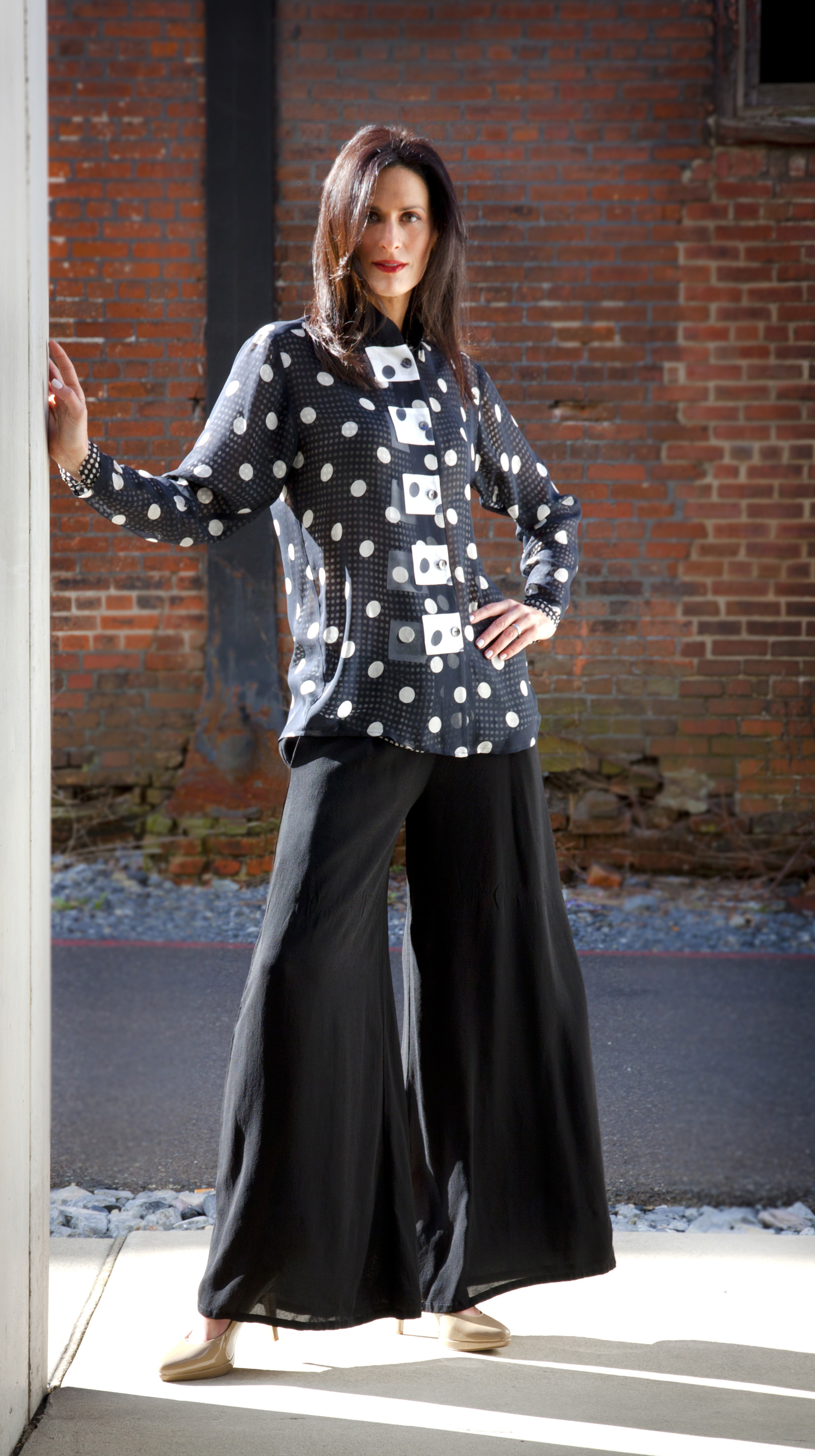 model with black and white shirt accented with squares