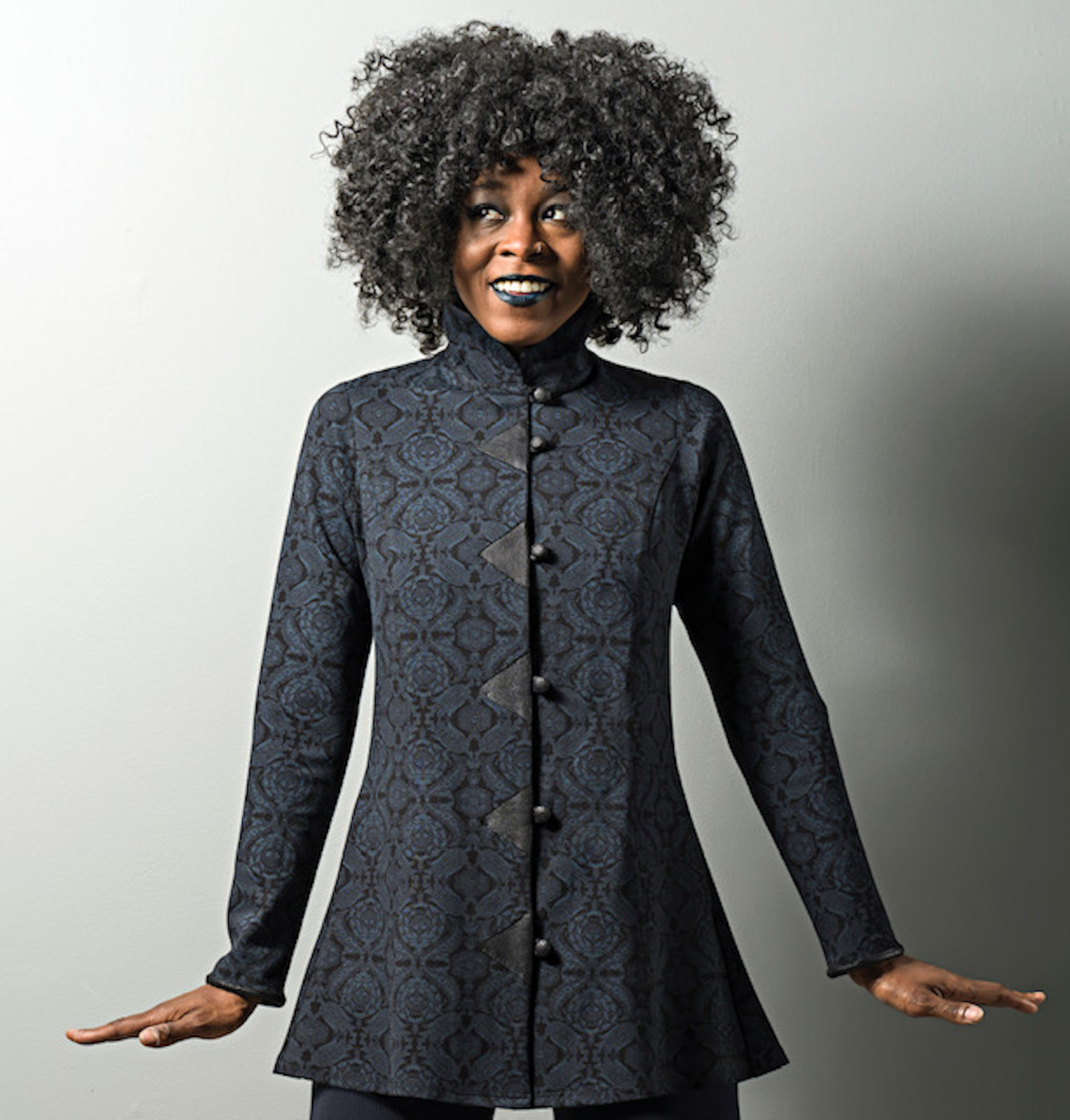 model with long, high-collared jacket