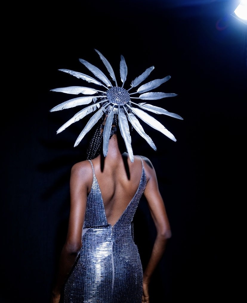 hat with many feathers radiating ourwards