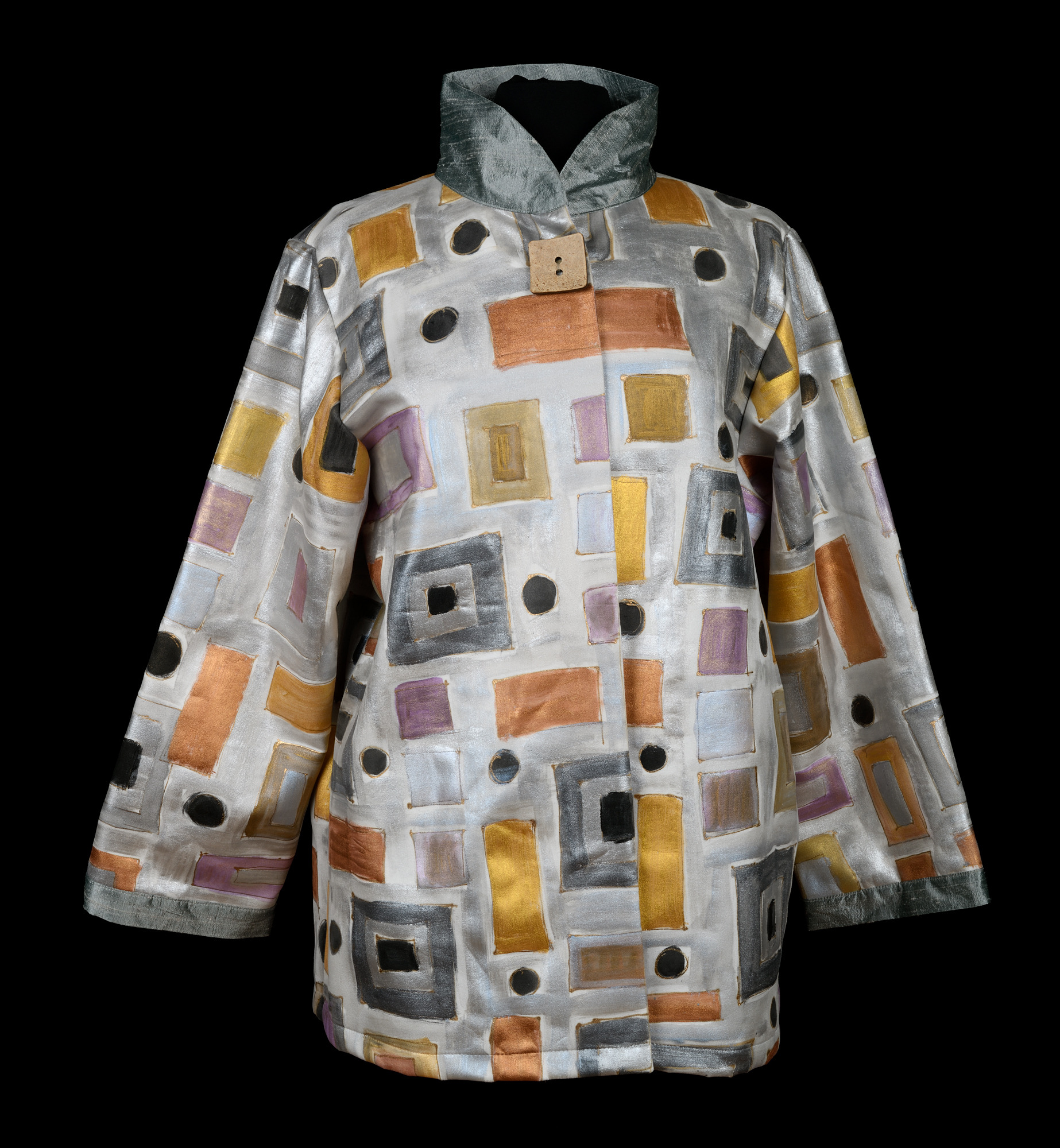 silver jacket with black, rust, and yellow