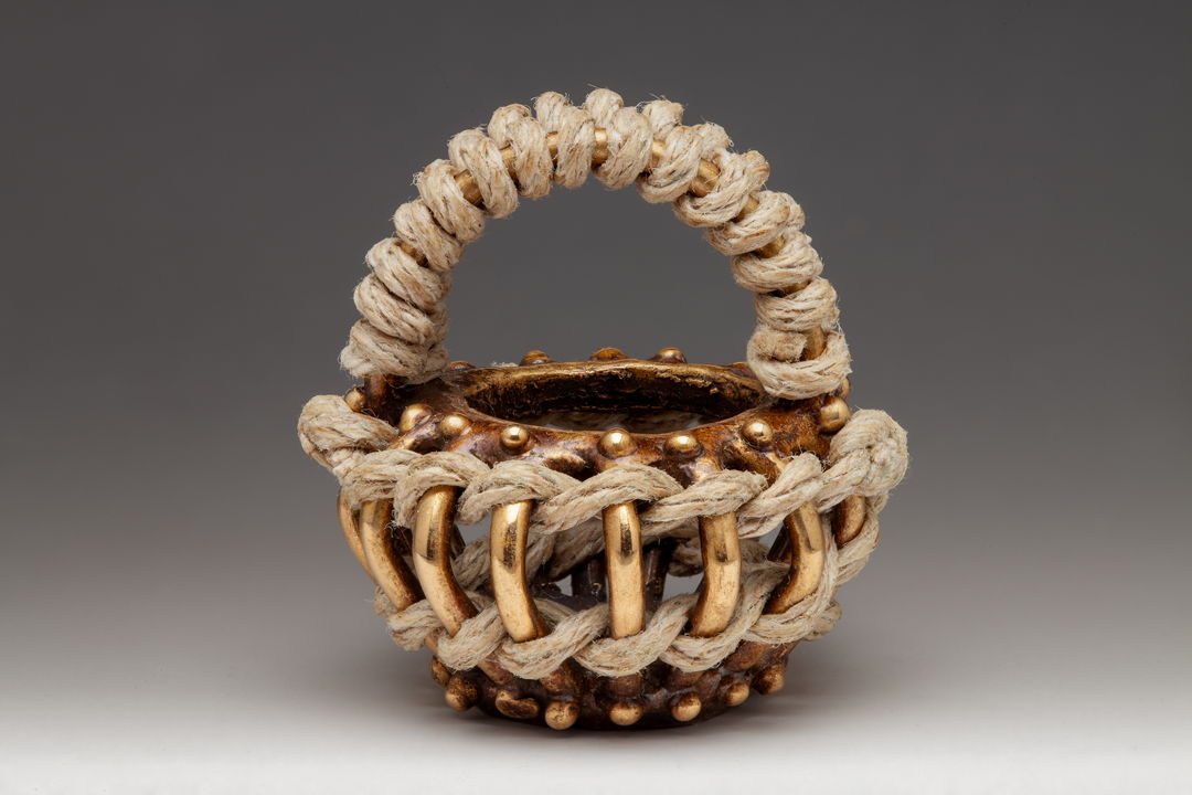 Cast basket with woven and twined hemp